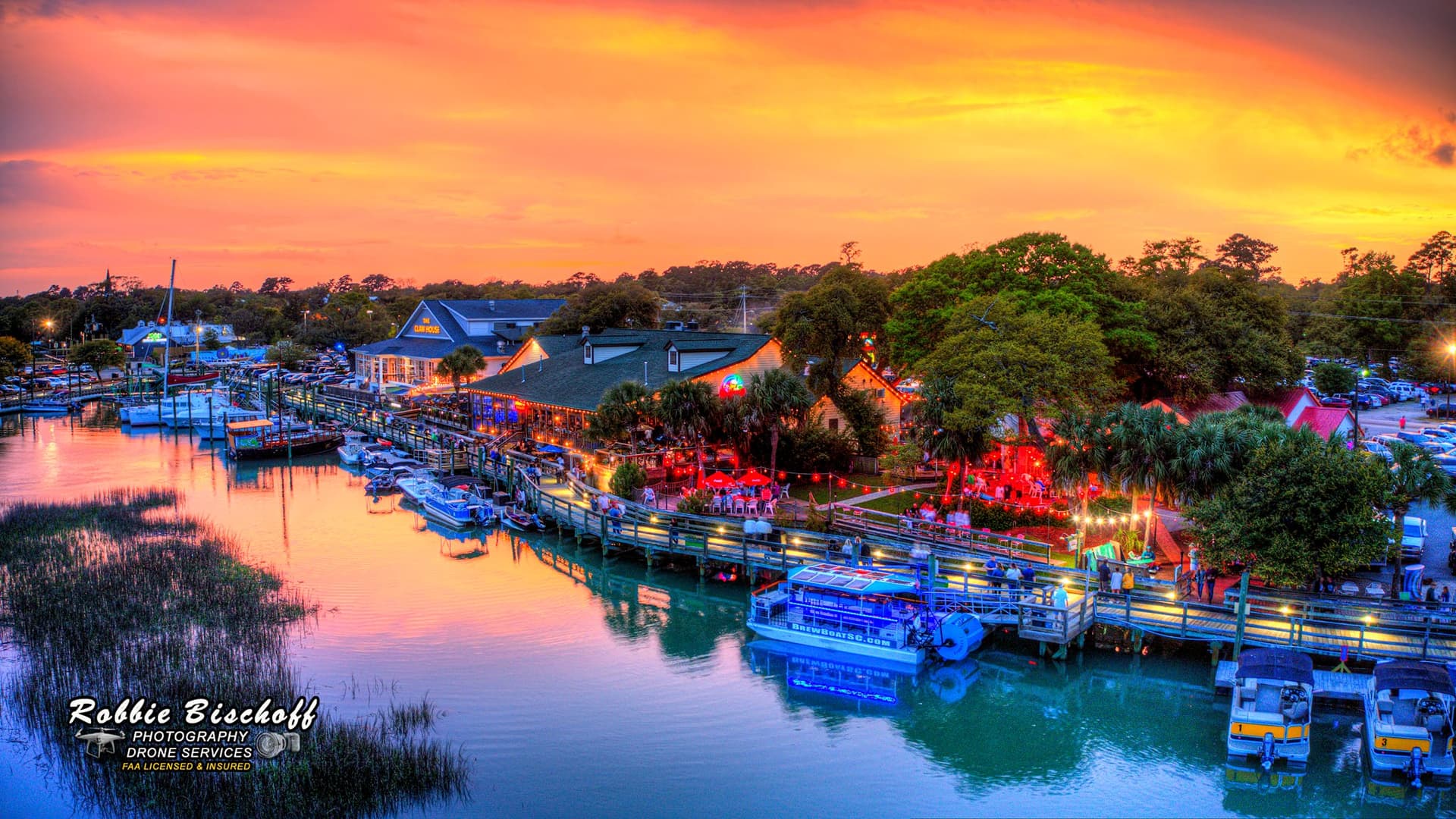 The MarshWalk in Murrells Inlet at sunset over the waterfront
